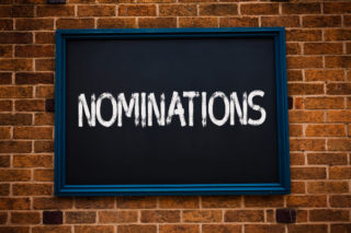 Conceptual hand writing showing Nominations. Business photo showcasing Suggestions of someone or something for a job position or prize Framed hang black board study class brick wall background